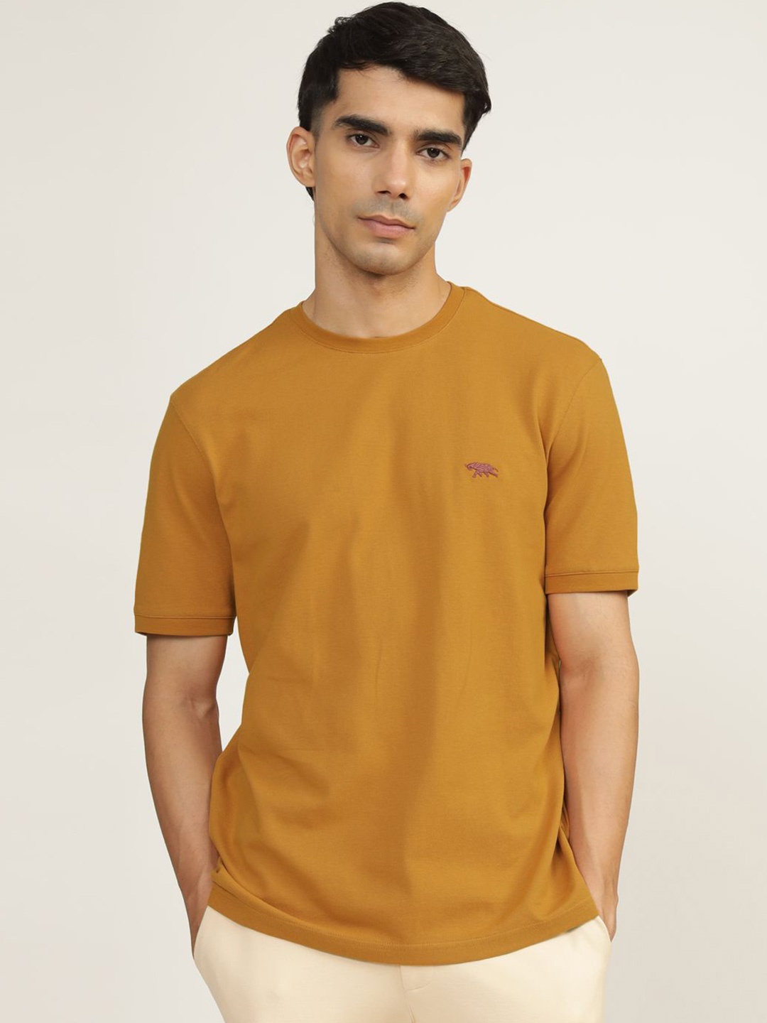 

Andamen Men Solid Round Neck Cotton T-shirt, Gold