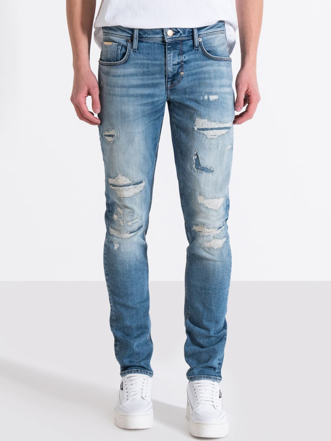 

Antony Morato Men Tapered Fit Highly Distressed Heavy Fade Stretchable Jeans, Blue