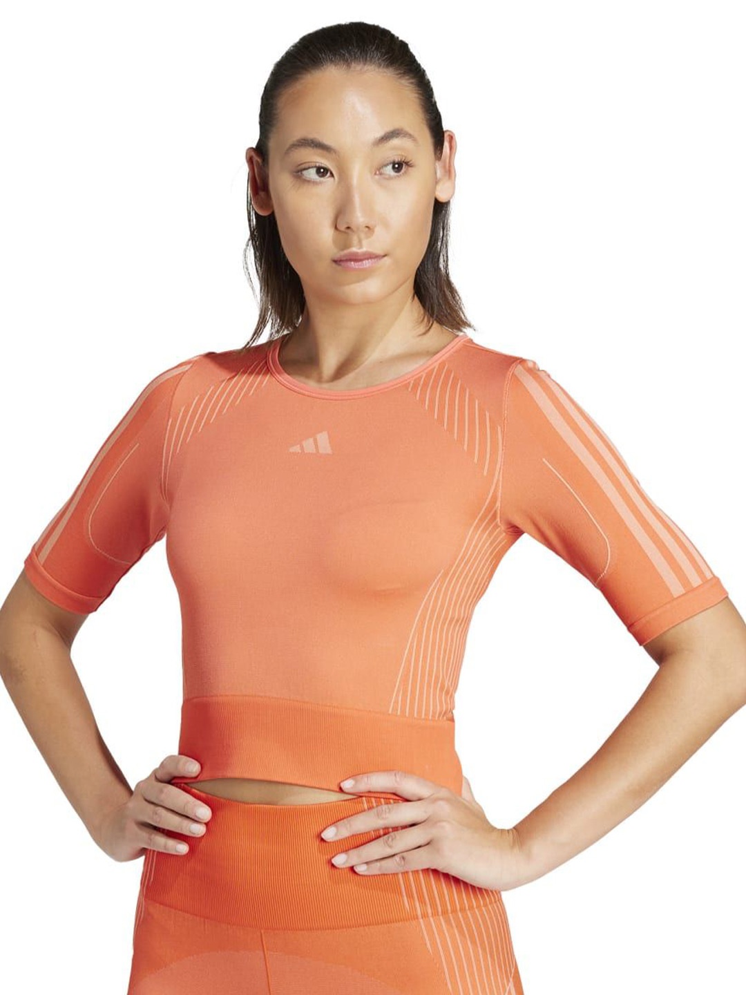 

ADIDAS Women Striped Round Neck Nylon Slim Fit T-shirt, Peach