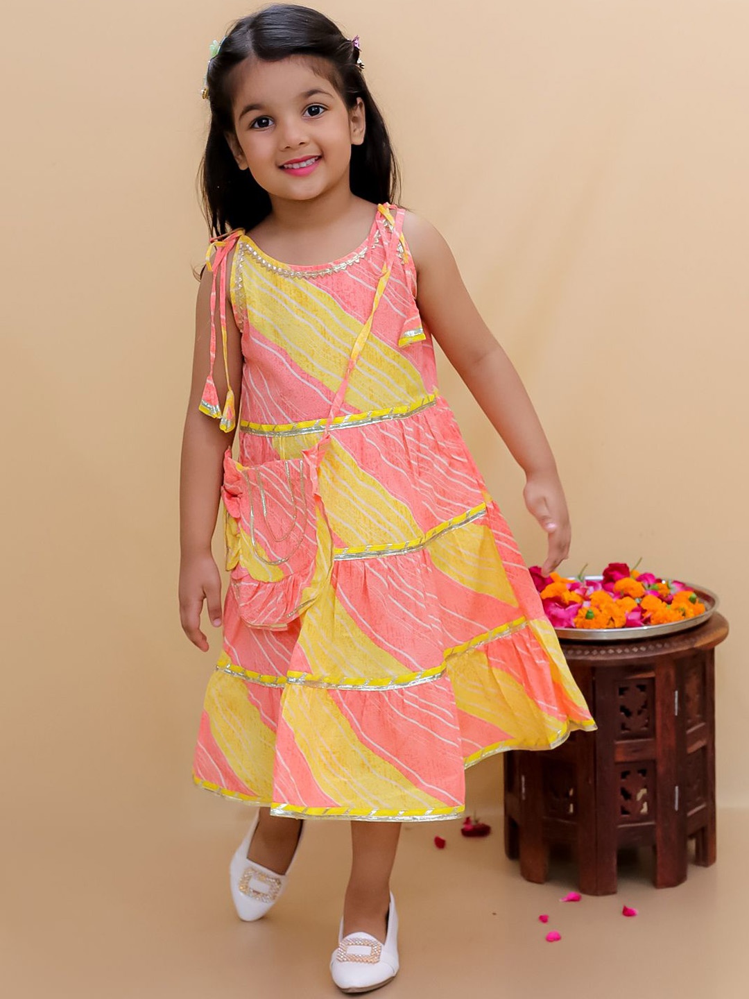 

Bold N Elegant Girls Leheriya Printed Sleeveless Midi Frock With Matching Sling Bag, Yellow