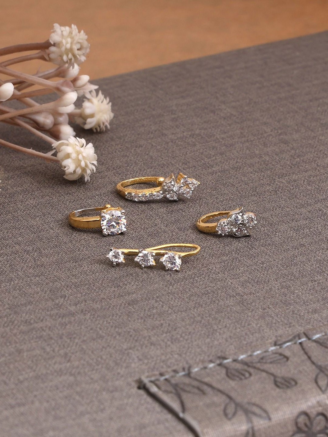 

Mali Fionna Set Of 4 Gold Plated American Diamond Studded Ring Nosepins