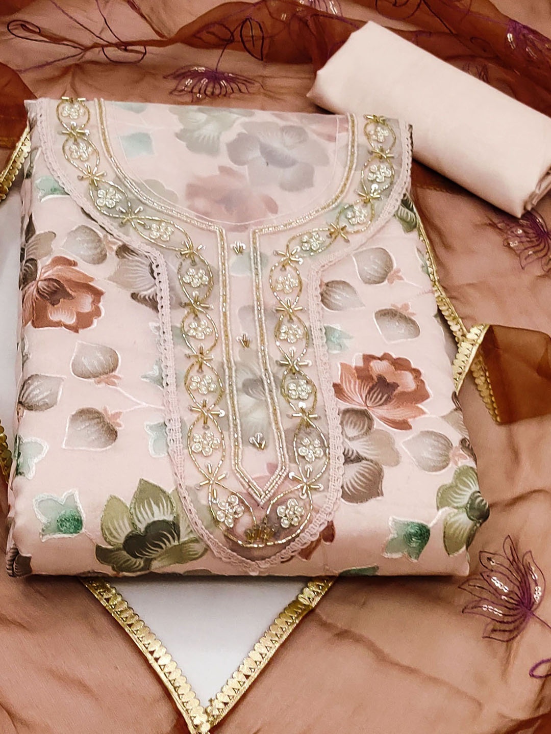 

Ishin Peach-coloured and Brown Floral Printed Organza Unstitched Dress Material