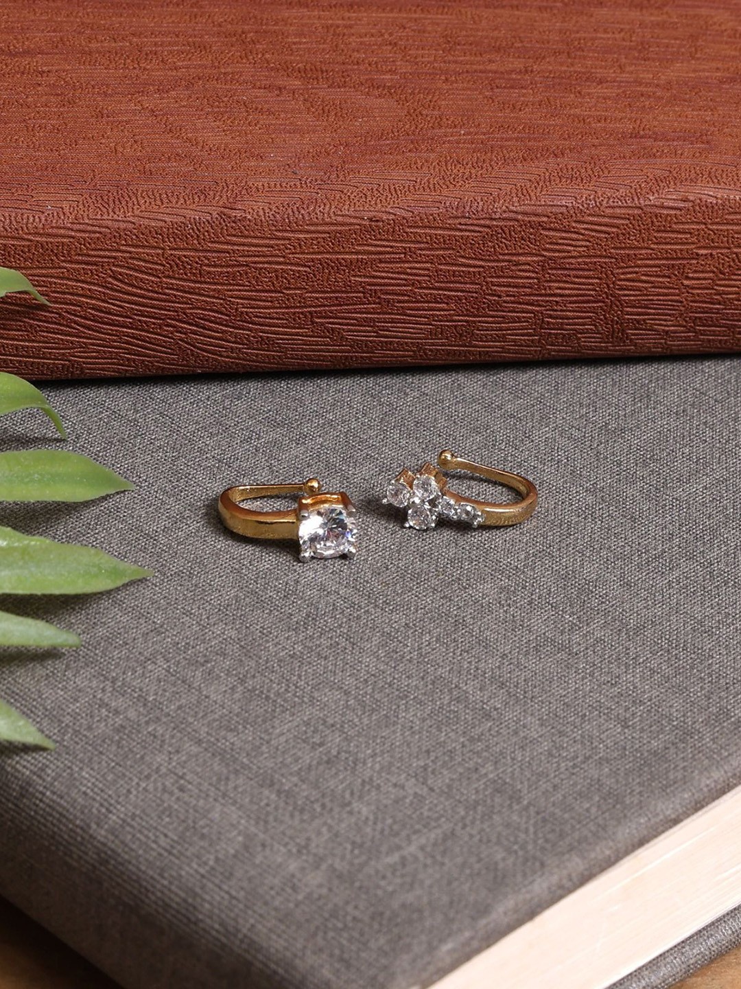 

Mali Fionna Set Of 2 Gold Plated American Diamond Studded Ring Nosepins