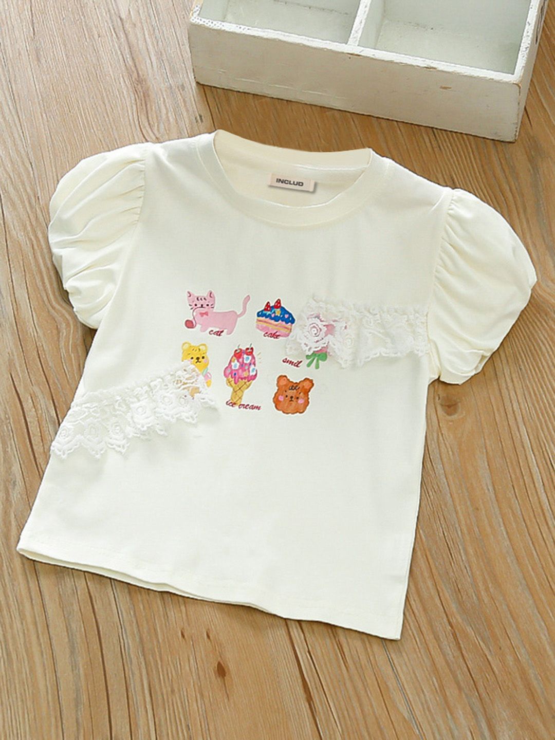 

INCLUD Girls Graphic Printed Round Neck Cotton Top, White