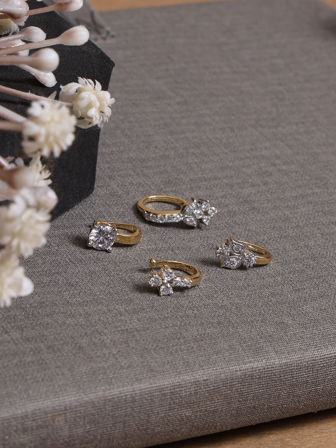 

Mali Fionna Set Of 4 Gold Plated American Diamond Studded Ring Nosepins