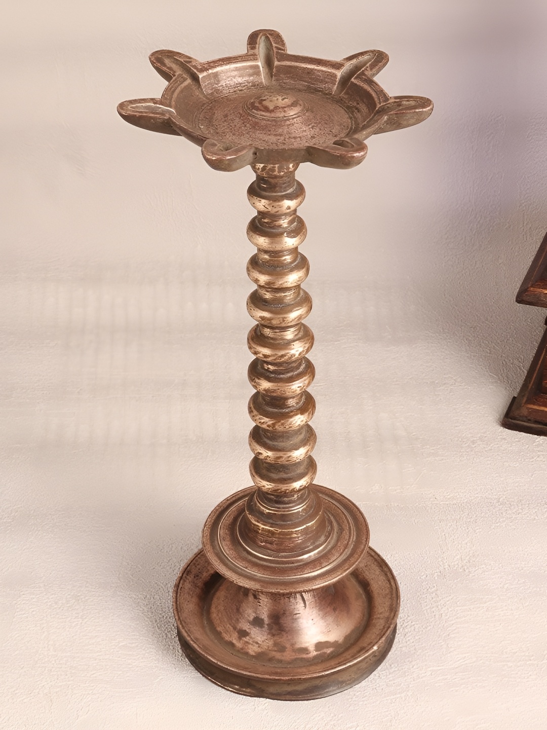 

Indianshelf Bronze and Black Brass Diwali Textured Standing Diya