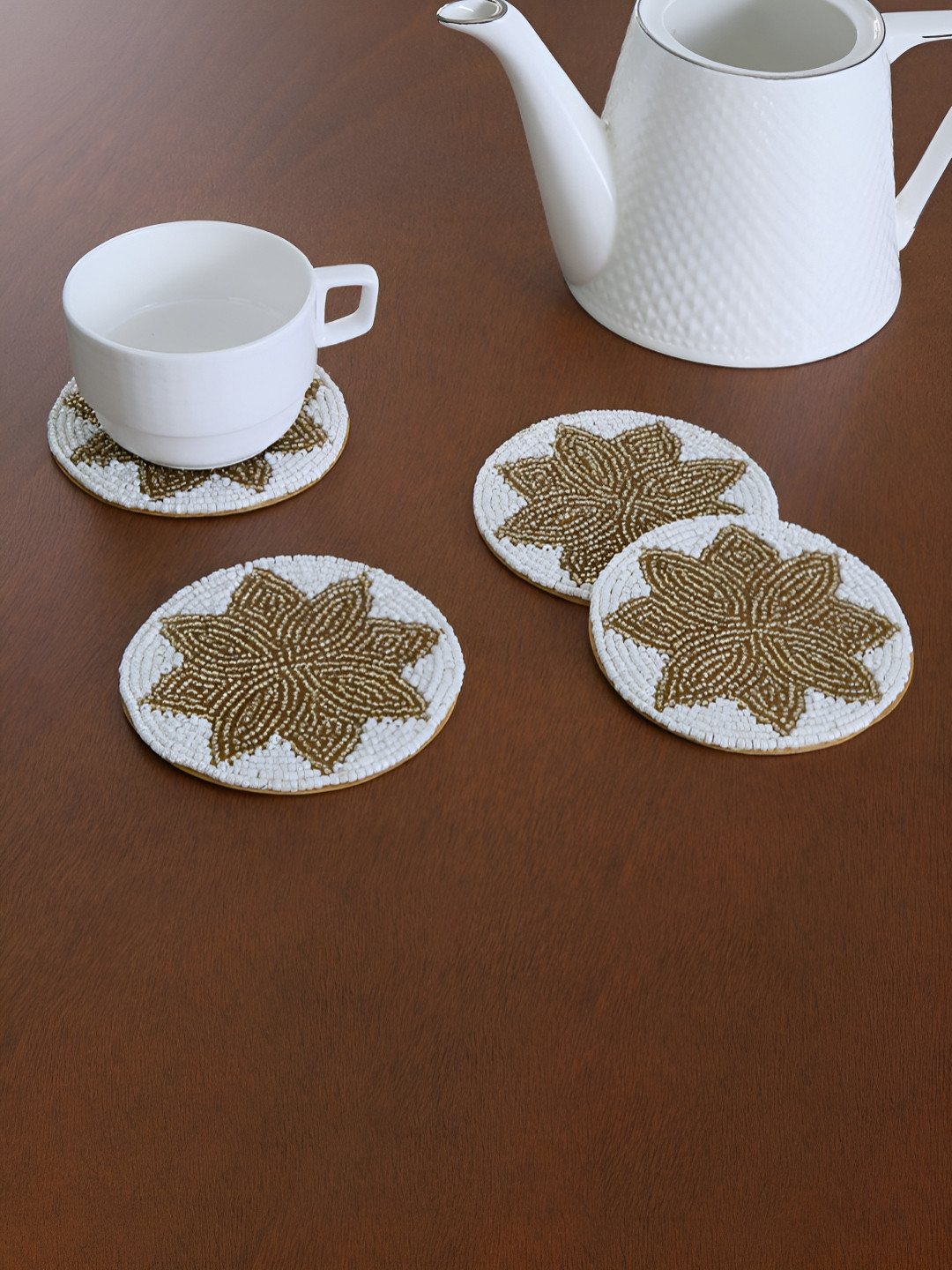 

Athome by Nilkamal Off White 4 Pieces Embellished Round Shaped Beaded Coasters, Gold