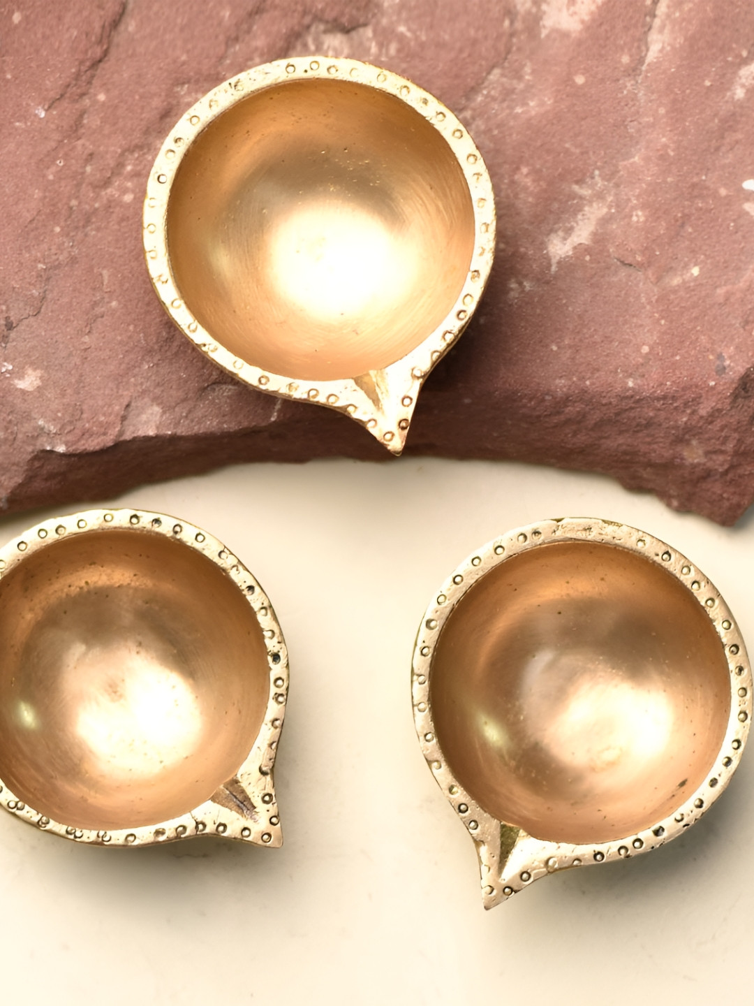 

Indianshelf Gold-Toned 3 pieces Textured Brass Pooja Diya