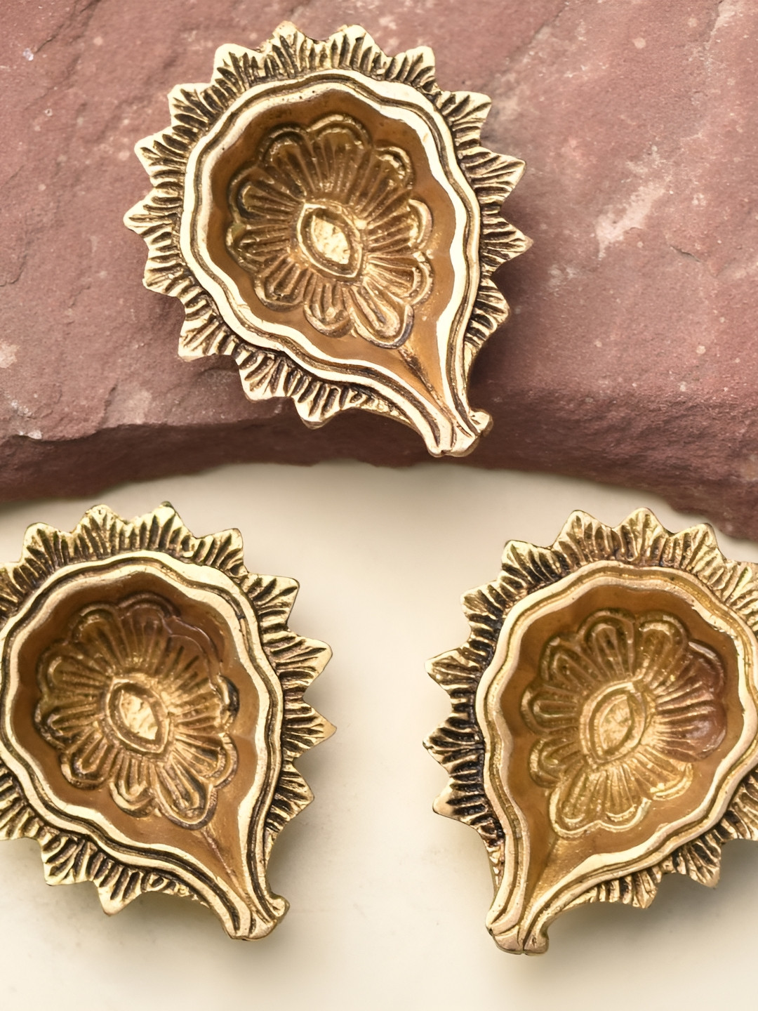 

Indianshelf Gold-Toned 3 Pieces Brass Textured Pooja Diyas