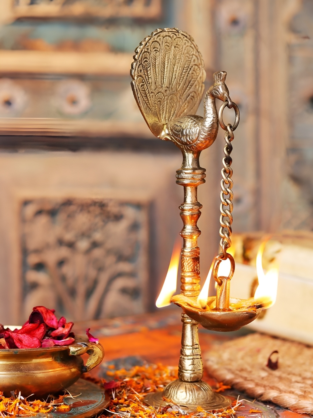 

Indianshelf Gold Toned Textured Brass Diwali Peacock Diya