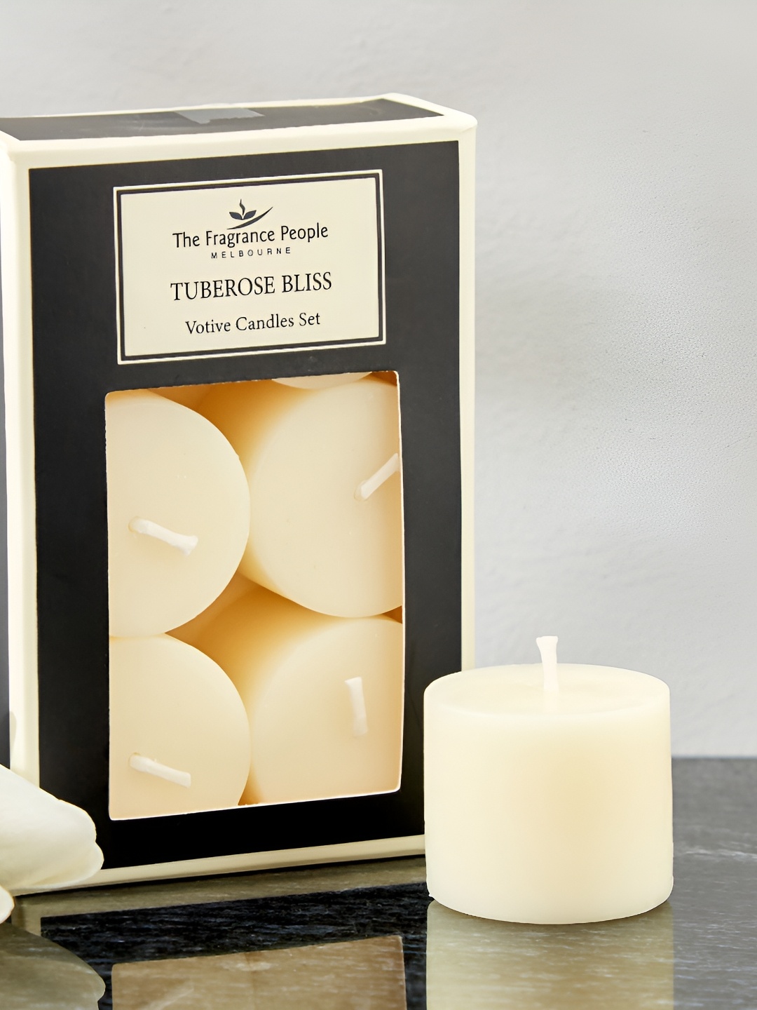 

Home Centre Boutique White and Black 6 Pieces Tuberose Bliss Votive Pillar Candle