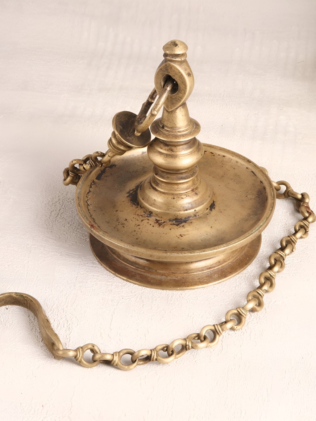 

Indianshelf Bronze Textured Brass Hanging Pooja Diya