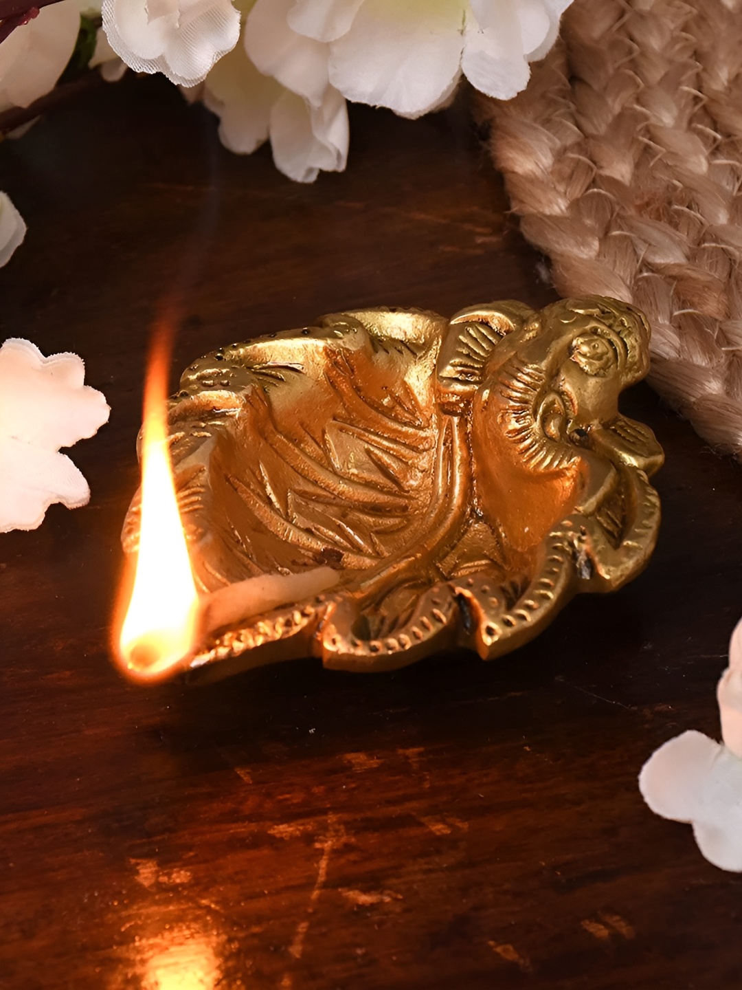 

Indianshelf Gold Toned Lord Ganesha Leaf Textured Brass Diya