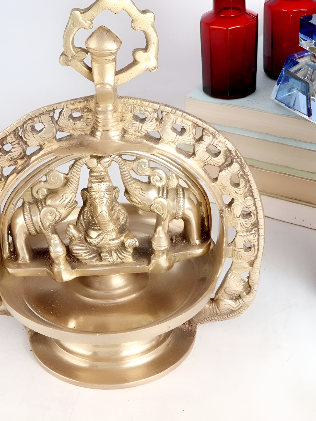 

Indianshelf Gold Toned Ganesha Idol Textured Hanging Brass Diya