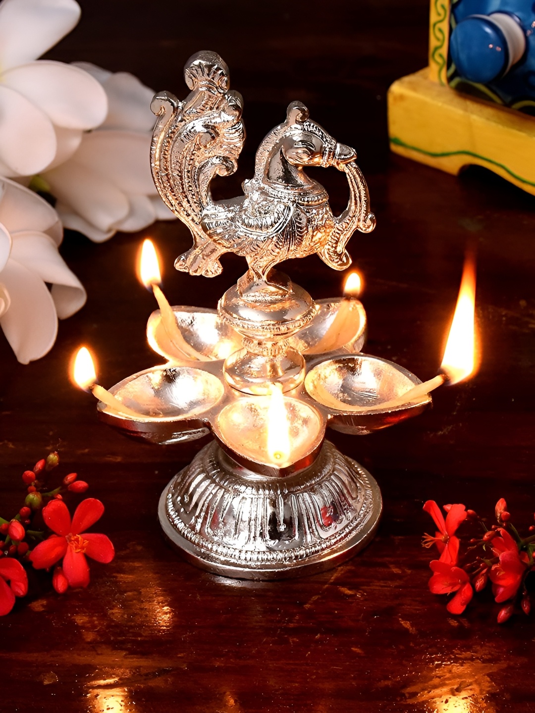

Indianshelf Silver Toned Textured Brass Diwali Peacock Deepa Diya