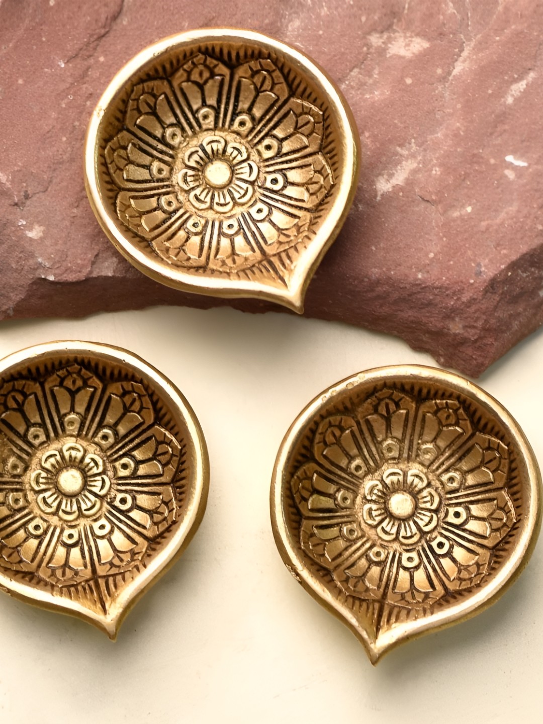 

Indianshelf Gold Toned 3 Pieces Textured Big Flower Diyas