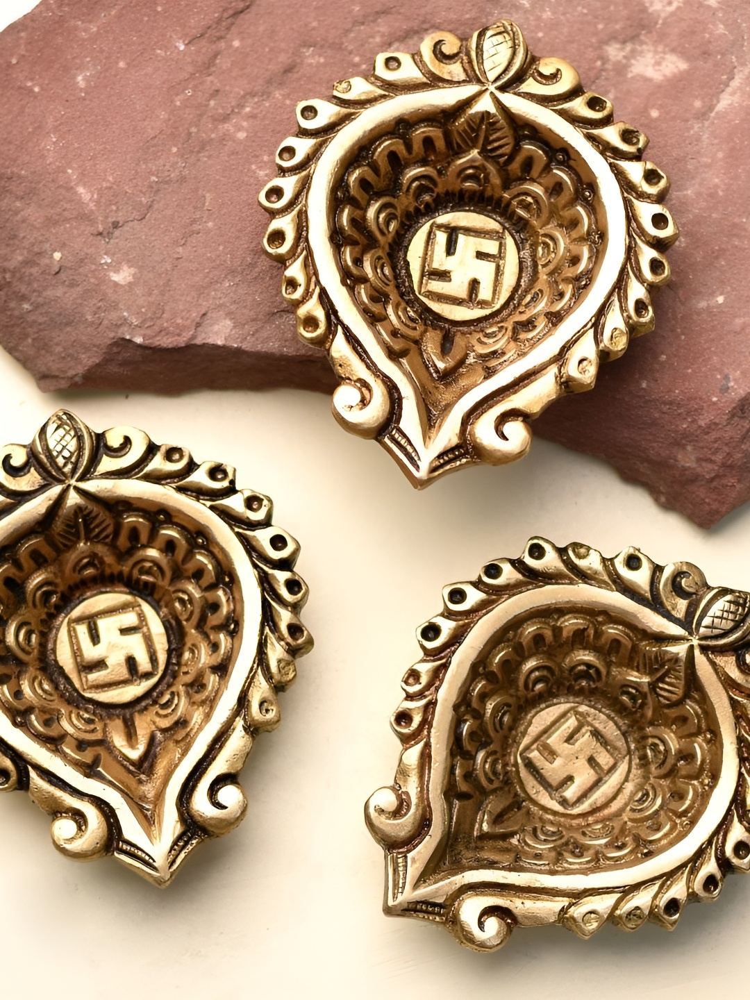 

Indianshelf Gold-Toned 3 Pieces Brass Heart Shaped Swastika Diya