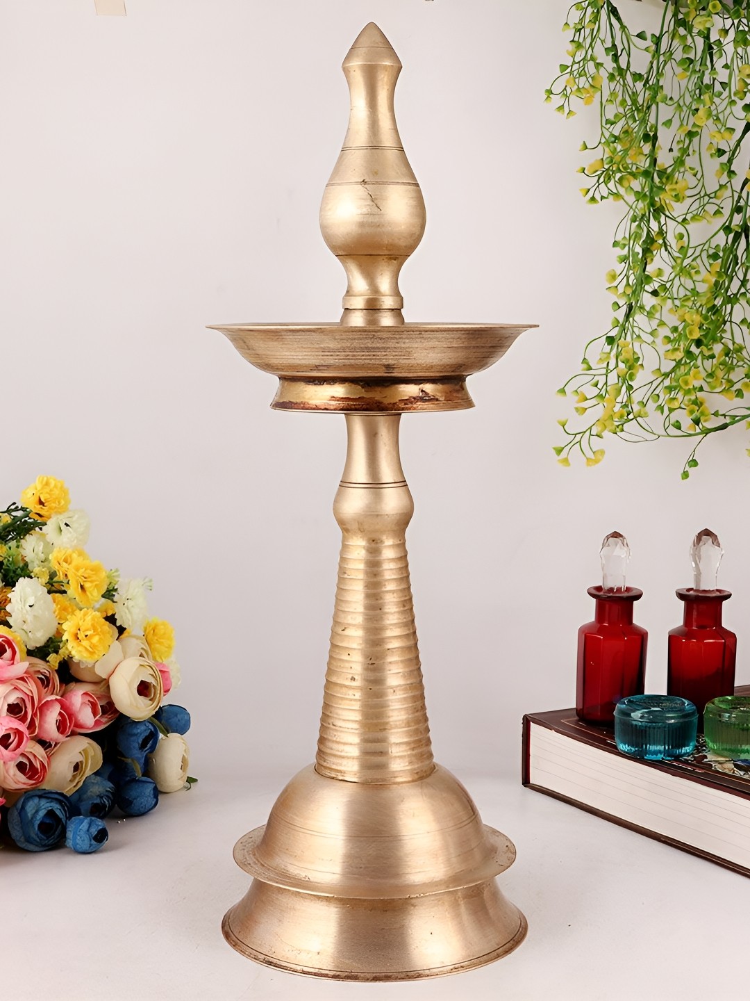 

Indianshelf GoldToned and Black Brass Textured Standing Diwali Pooja Diya, Gold