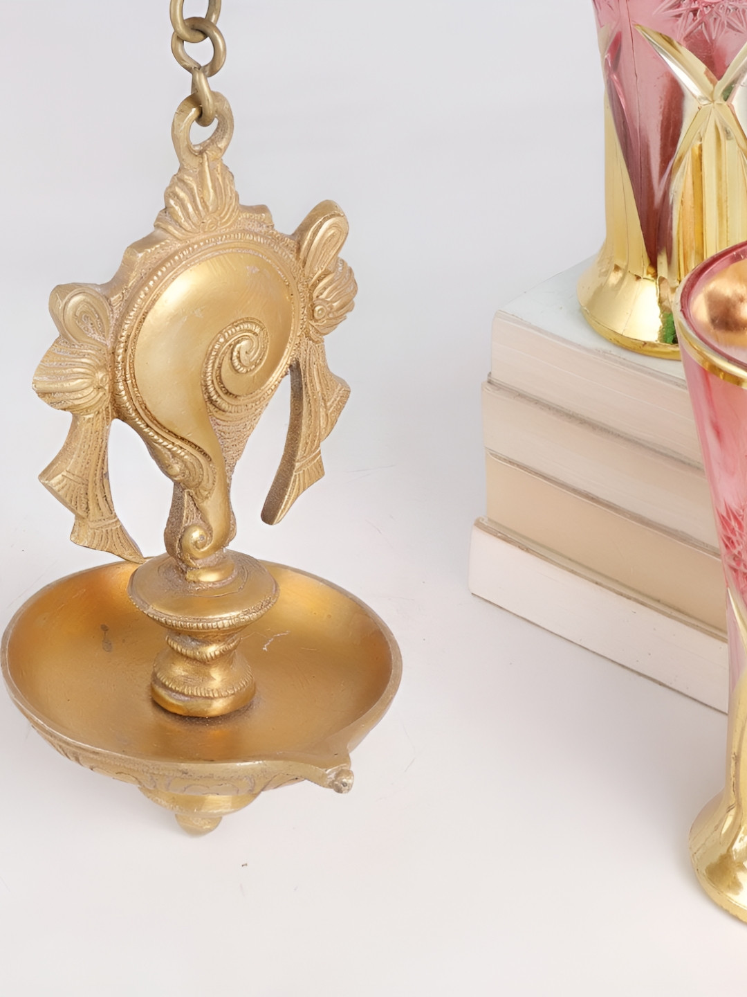 

Indianshelf Gold-Toned Textured Brass Hanging Diya Pooja Essentials