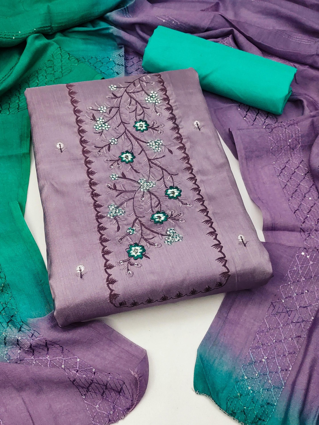

Ishin Purple & Green Floral Embroidered Unstitched Dress Material