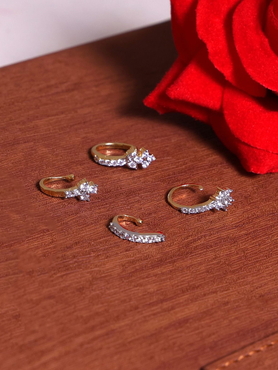 

Mali Fionna Set Of 4 Gold Plated American Diamond Studded Ring Nosepins