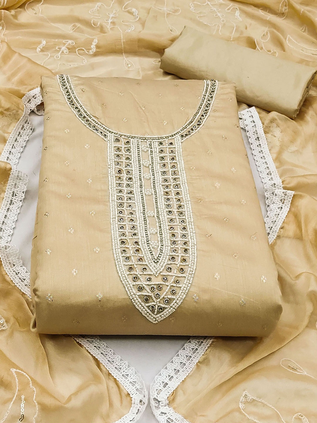 

Ishin Beige Floral Embroidered Beads and Stones Unstitched Dress Material