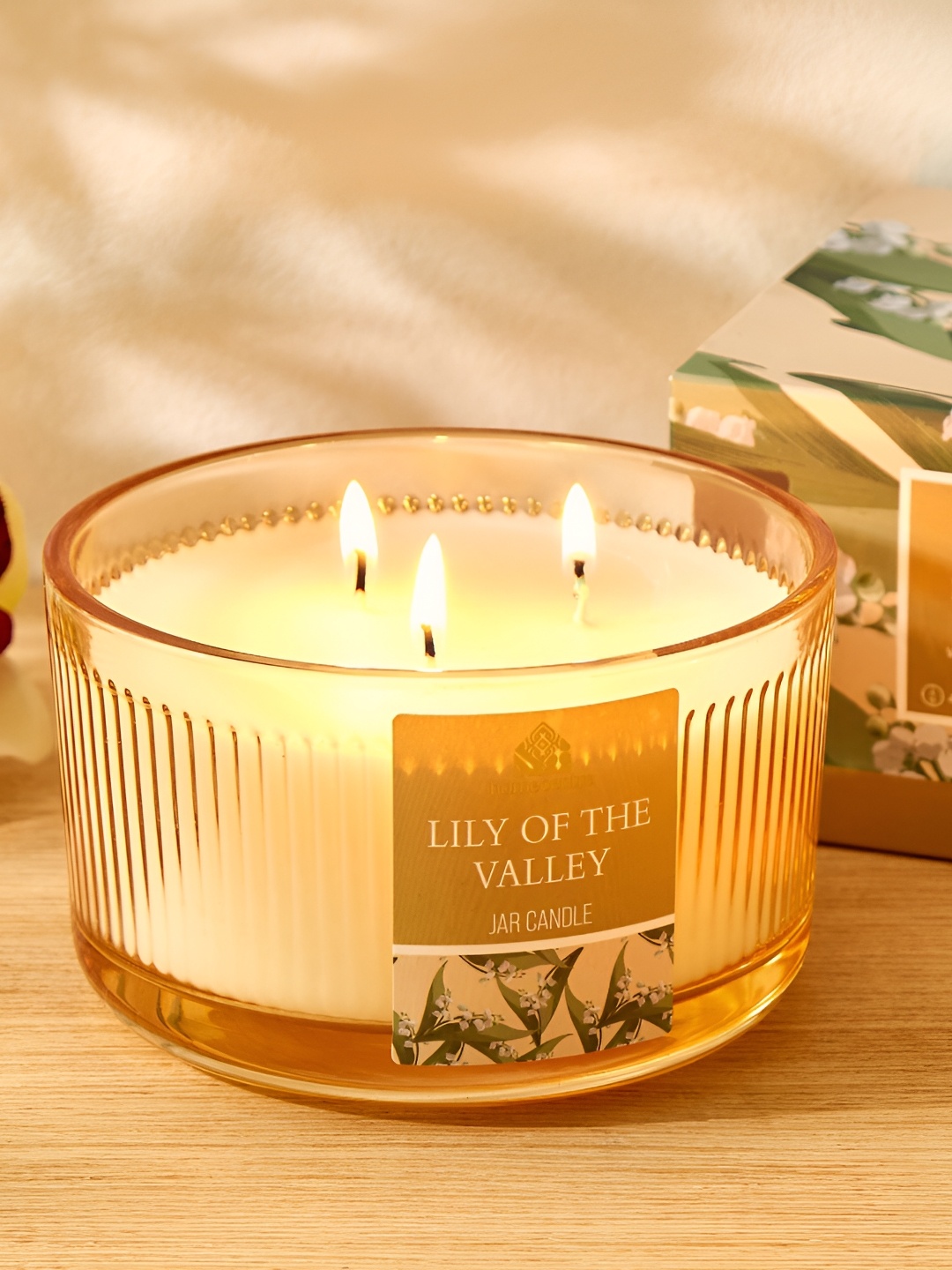 

Home Centre Utopia Beige and Transparent Lily Of The Valley Scented Jar Candle