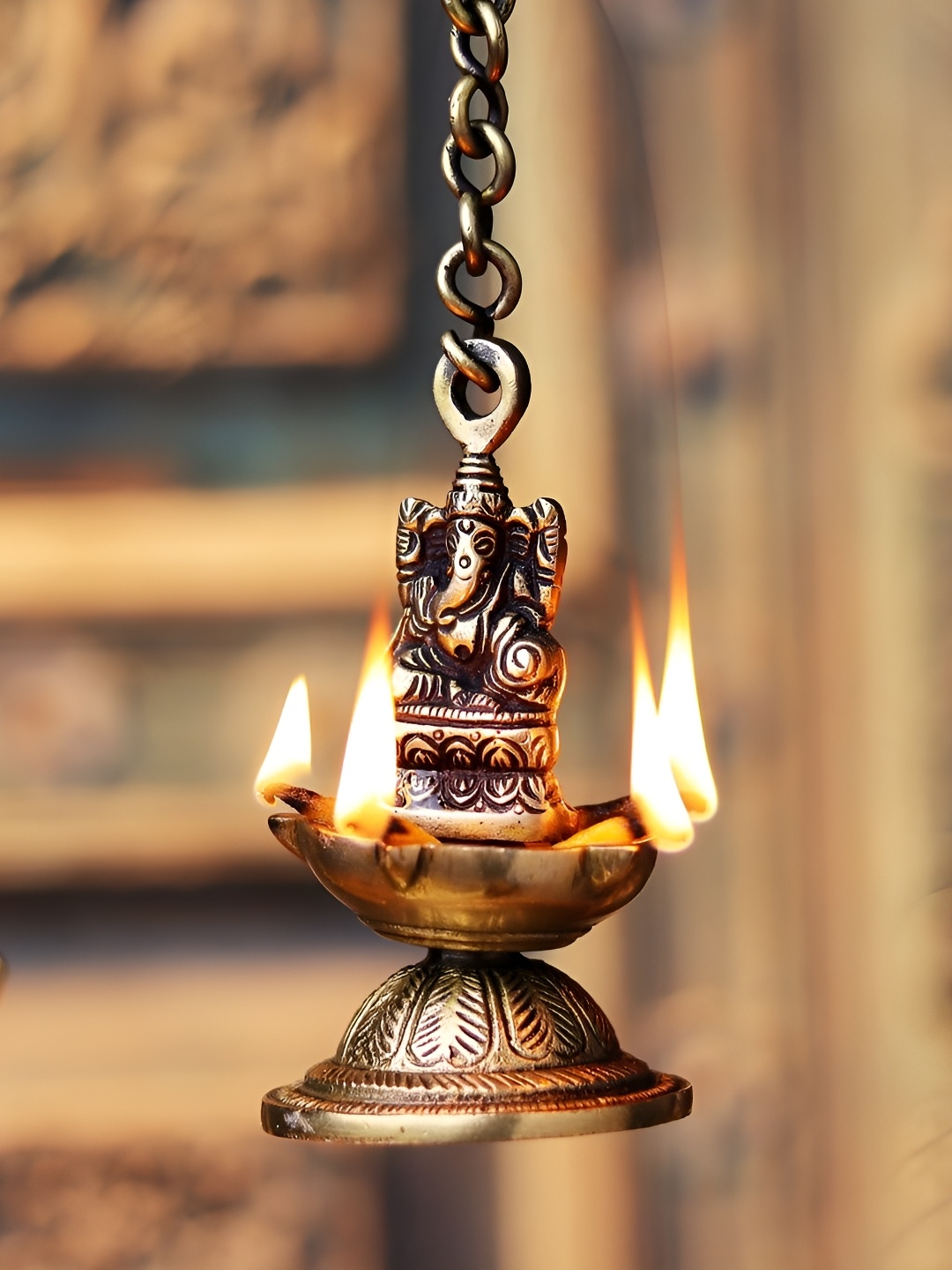 

Indianshelf Gold-Toned Textured Brass Lord Ganesha Hanging Deepak Diya