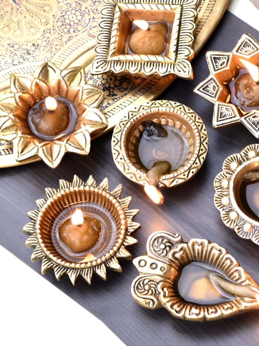 

Indianshelf GoldToned and Black 7 Pieces Textured Brass Diwali Pooja Diyas, Gold