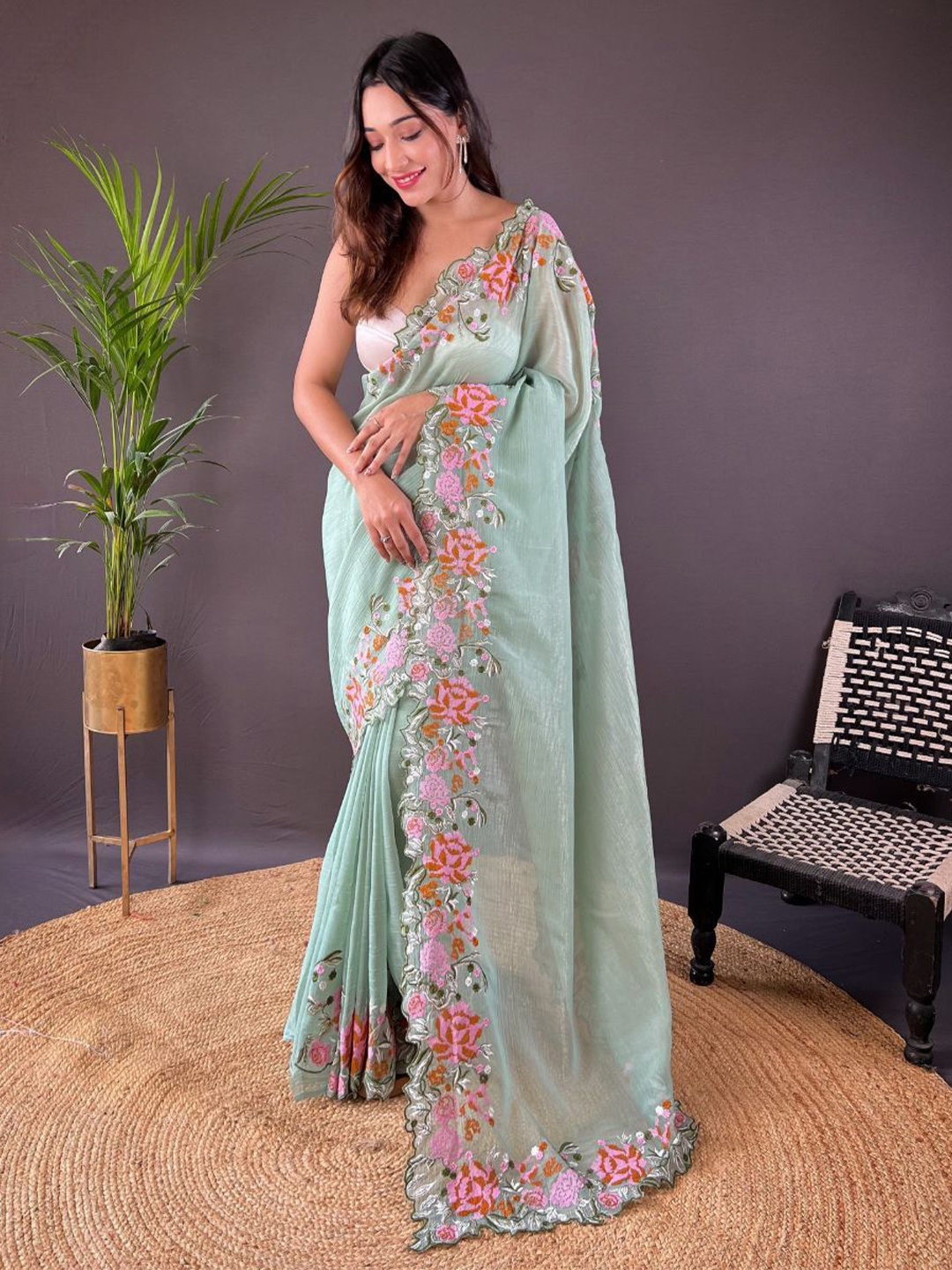 

Celeb Styles Floral Embroidered Solid Saree, Green