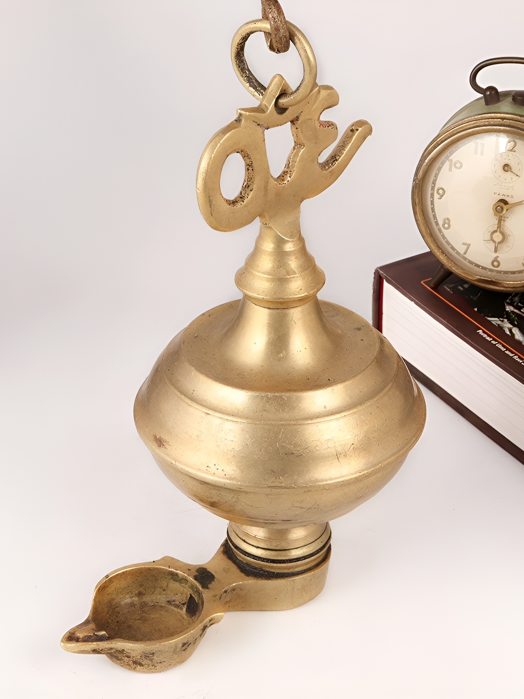 

Indianshelf Gold Toned Om Textured Brass Hanging Diya