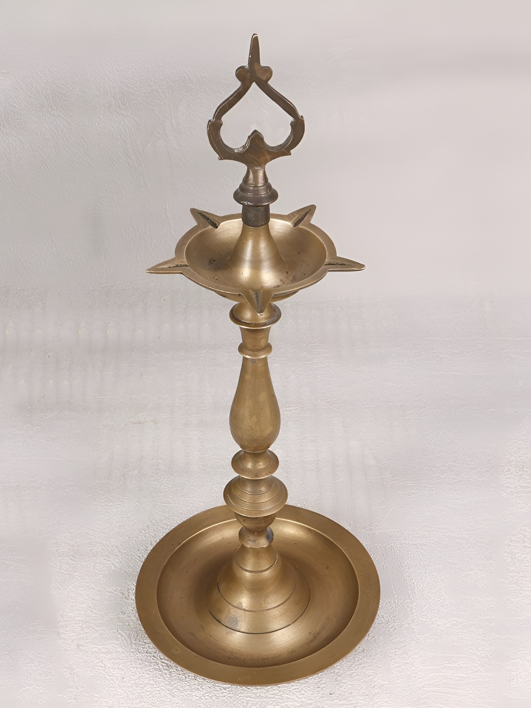 

Indianshelf Gold-Toned Textured Brass Pooja Diya, Bronze