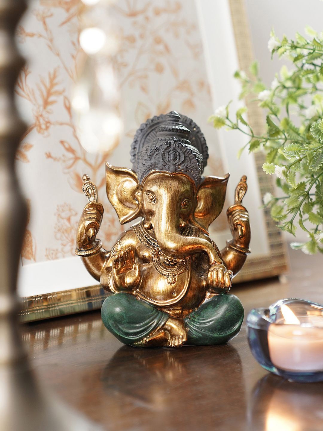 

Pure Home and Living Green & Gold Toned Ganesha Religious Figurine Showpiece
