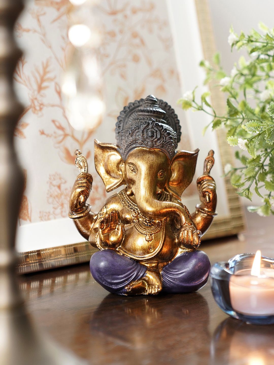 

Pure Home and Living Purple & Gold Toned Lord Ganesha Idol Showpiece
