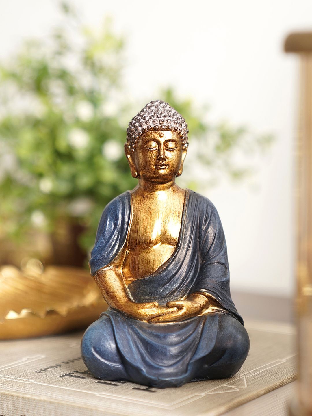 

Pure Home and Living Blue & Gold Toned Buddha Idol Showpiece