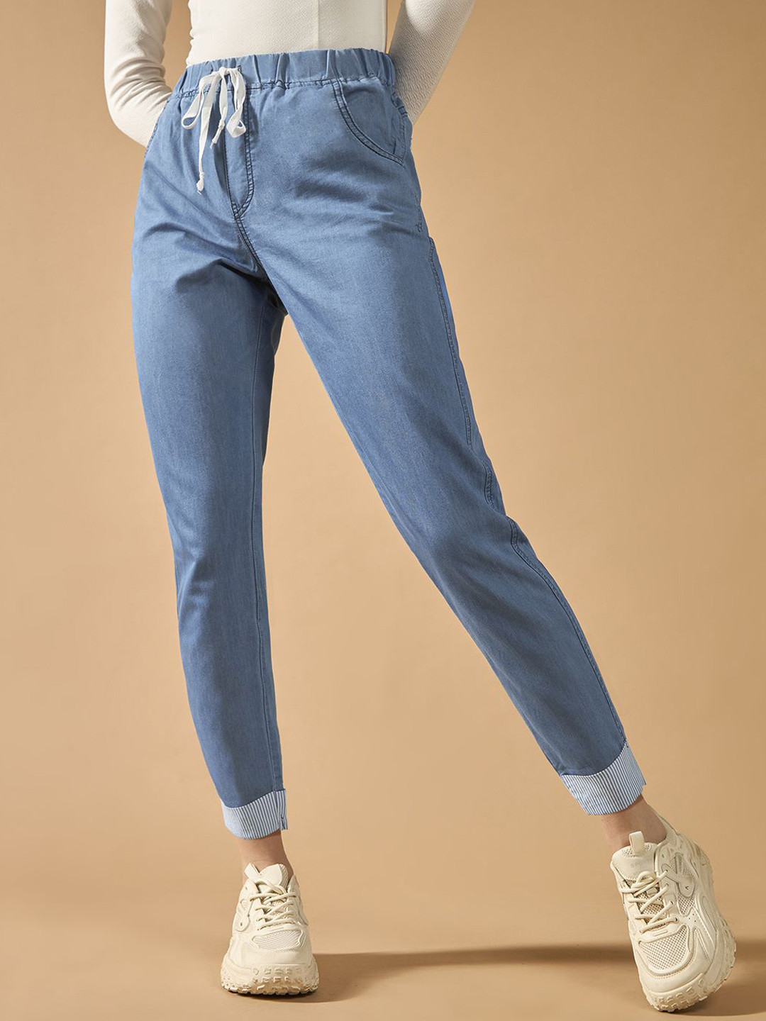 

The Roadster Women High Rise Solid Cropped Striped Detailing Denim Joggers, Blue