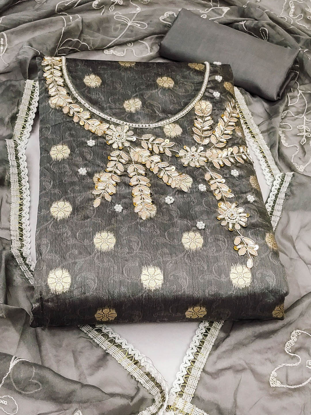 

Ishin Grey Ethnic Motifs Woven Design Beads and Stones Unstitched Dress Material