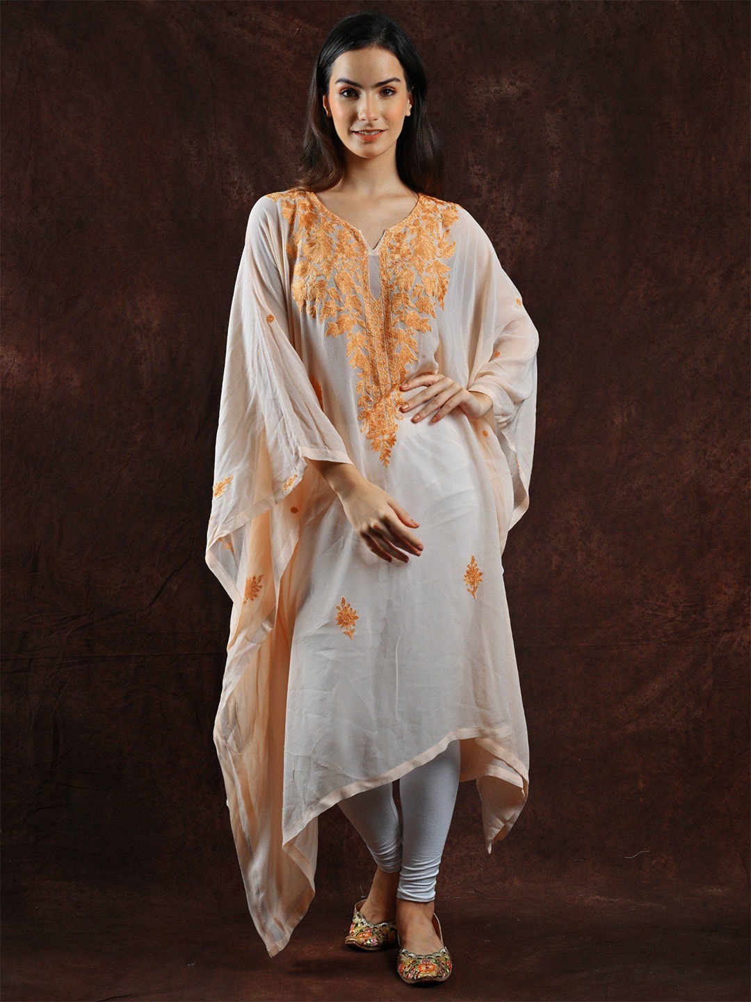 

Exotic India Peach Dust Georgette Diaphanous Kashmiri Kaftan with Aari Embroidered Flower