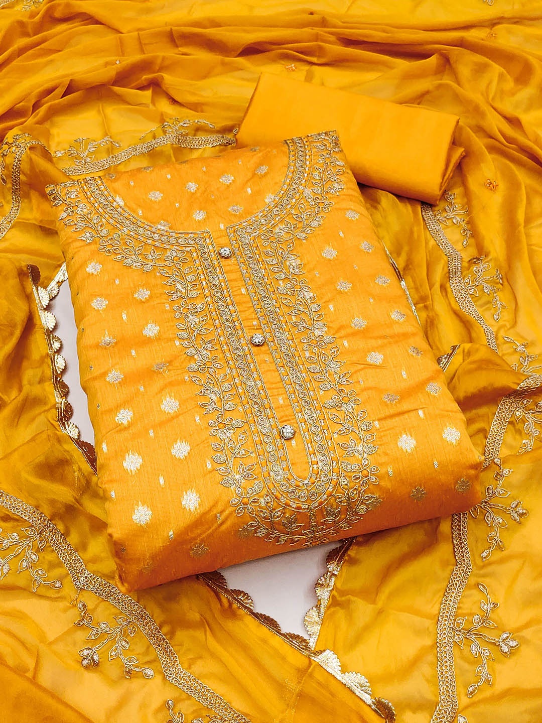 

Ishin Yellow Ethnic Motifs Woven Design Sequined Unstitched Dress Material