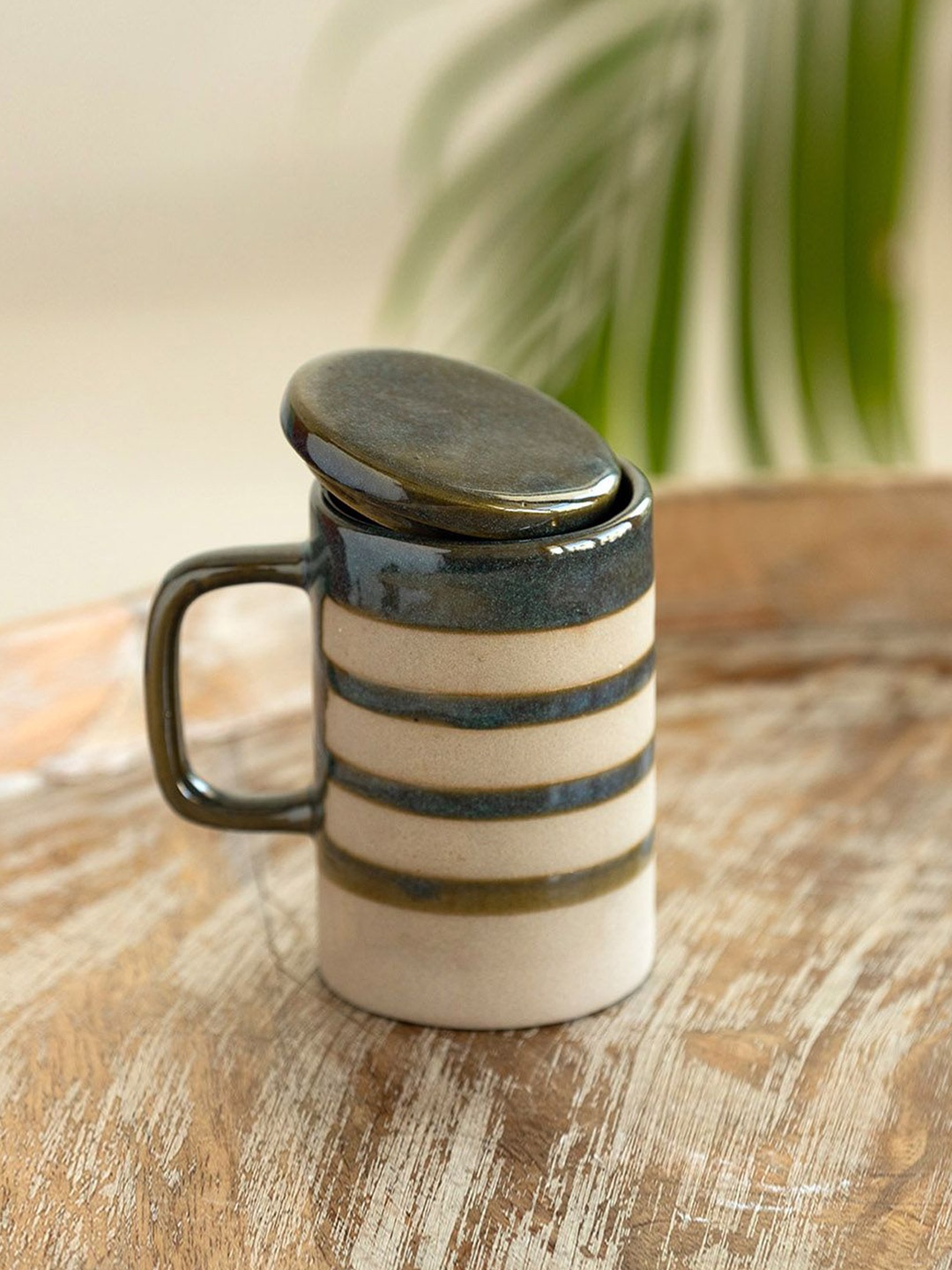 

ExclusiveLane Teal Blue & Beige Printed Ceramic Matte Mugs With Lid 320 ml