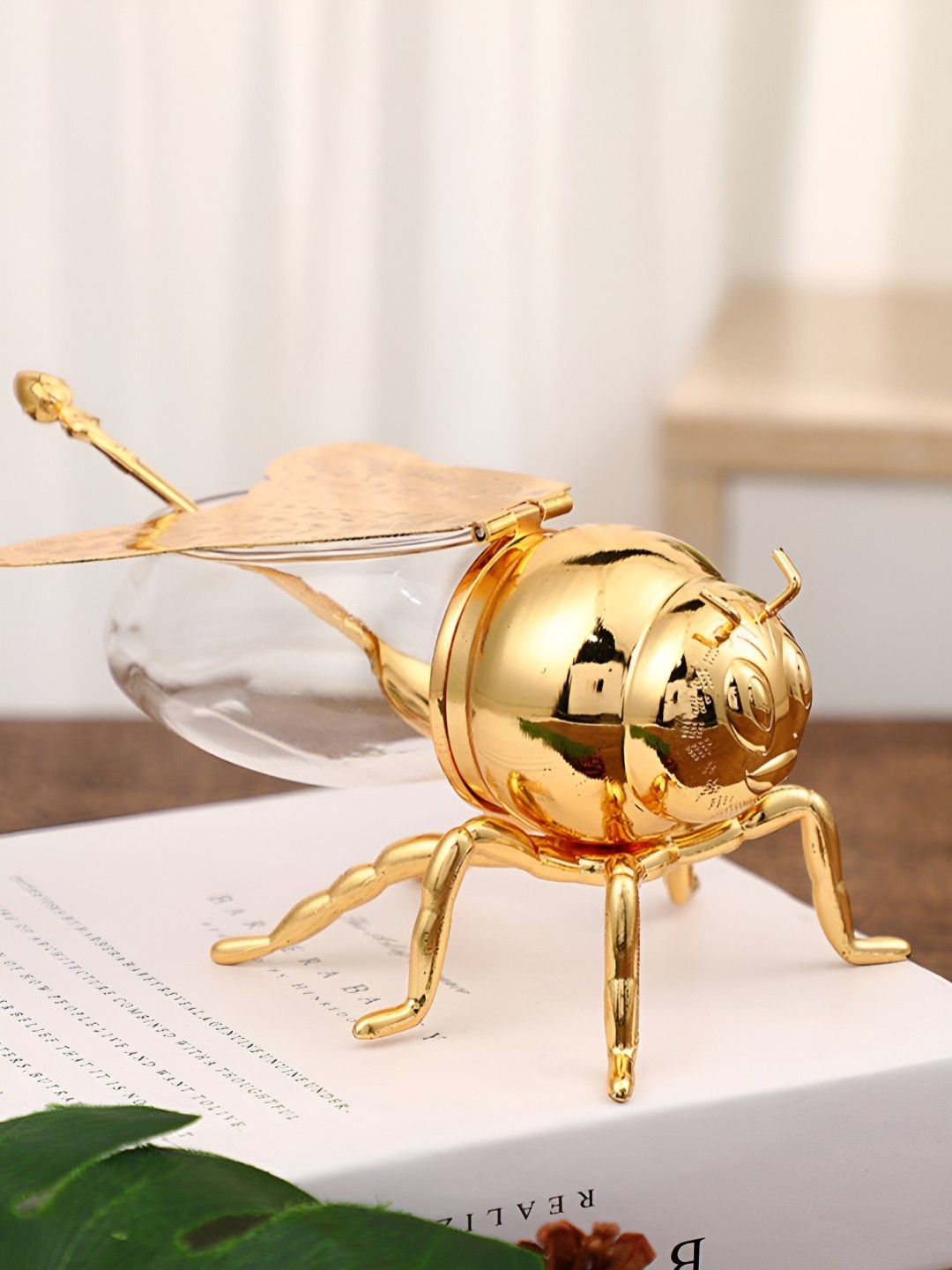 

SMOKEY COCKTAIL Gold-Toned & Transparent Animals Figurine Honeybee Jar & Spoon Showpiece