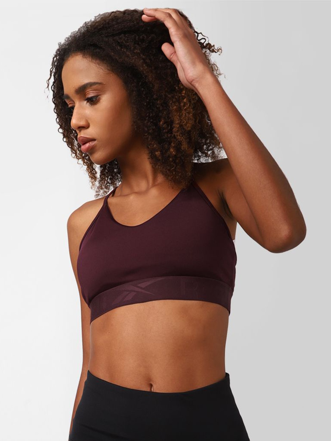 

Reebok Wor Comm Strappy Back Bra, Purple