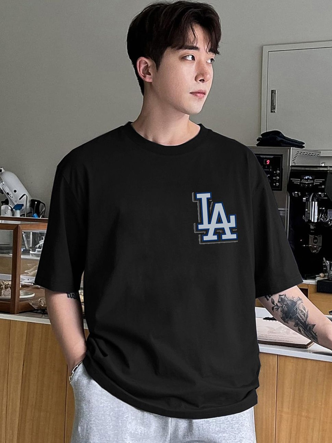 

CLAFOUTIS Men Typography Printed Round Neck Cotton Oversized T-shirt, Black