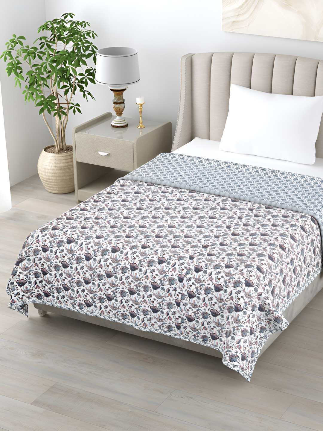 

Jinaya's White & Blue Floral Printed Cotton AC Room 300 GSM Reversible Double Bed Dohar