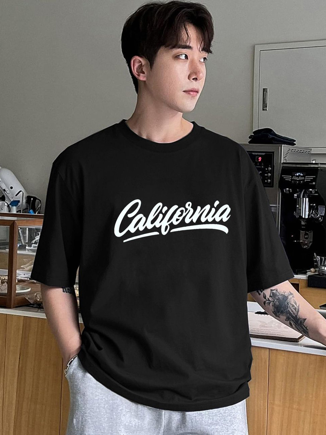 

CLAFOUTIS Men Typography Printed Round Neck Cotton Oversized T-shirt, Black