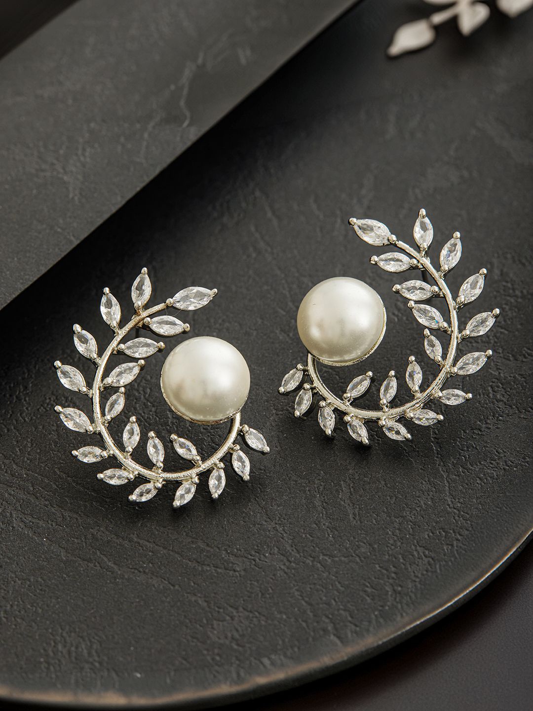 

Jazz and Sizzle Silver Plated Pearl & American Diamond Studded Contemporary Studs