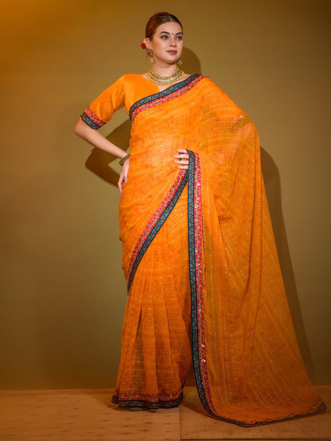 

Krimmple Striped Sequinned Pure Georgette Fusion Saree, Orange