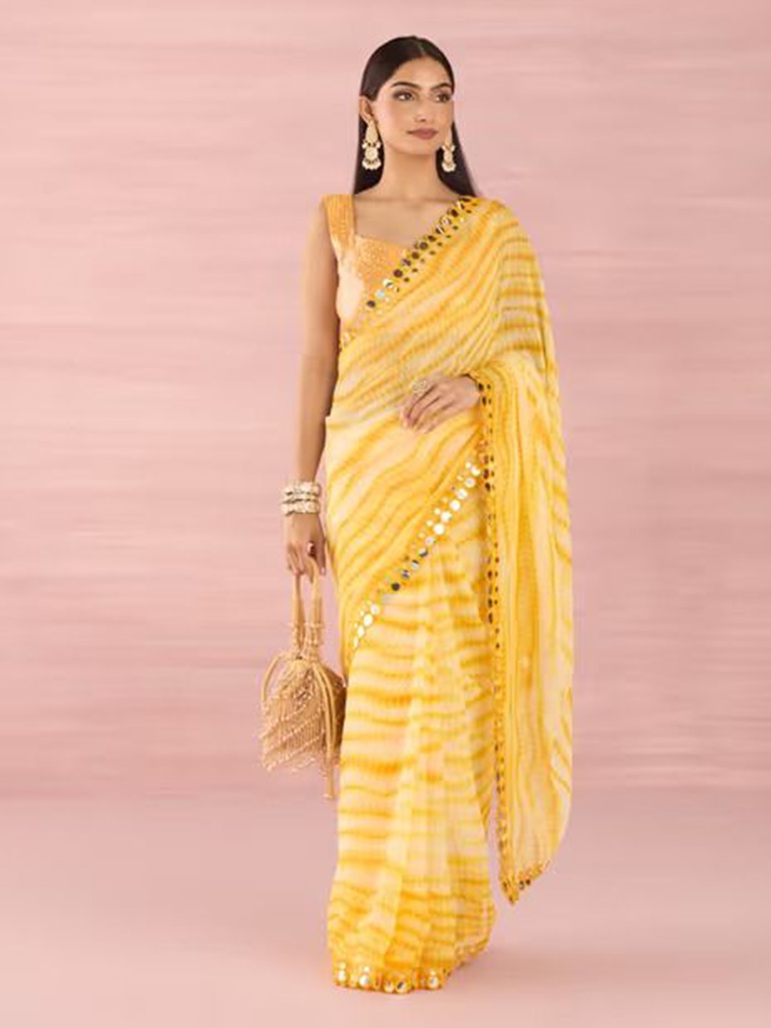 

Krimmple Tie and Dye Mirror Work Pure Georgette Saree, Yellow