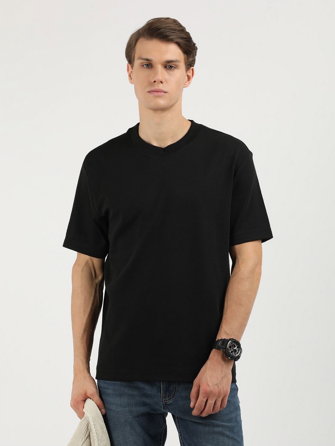 

Calvin Klein Jeans Men Solid Round Neck Cotton T-shirt, Black