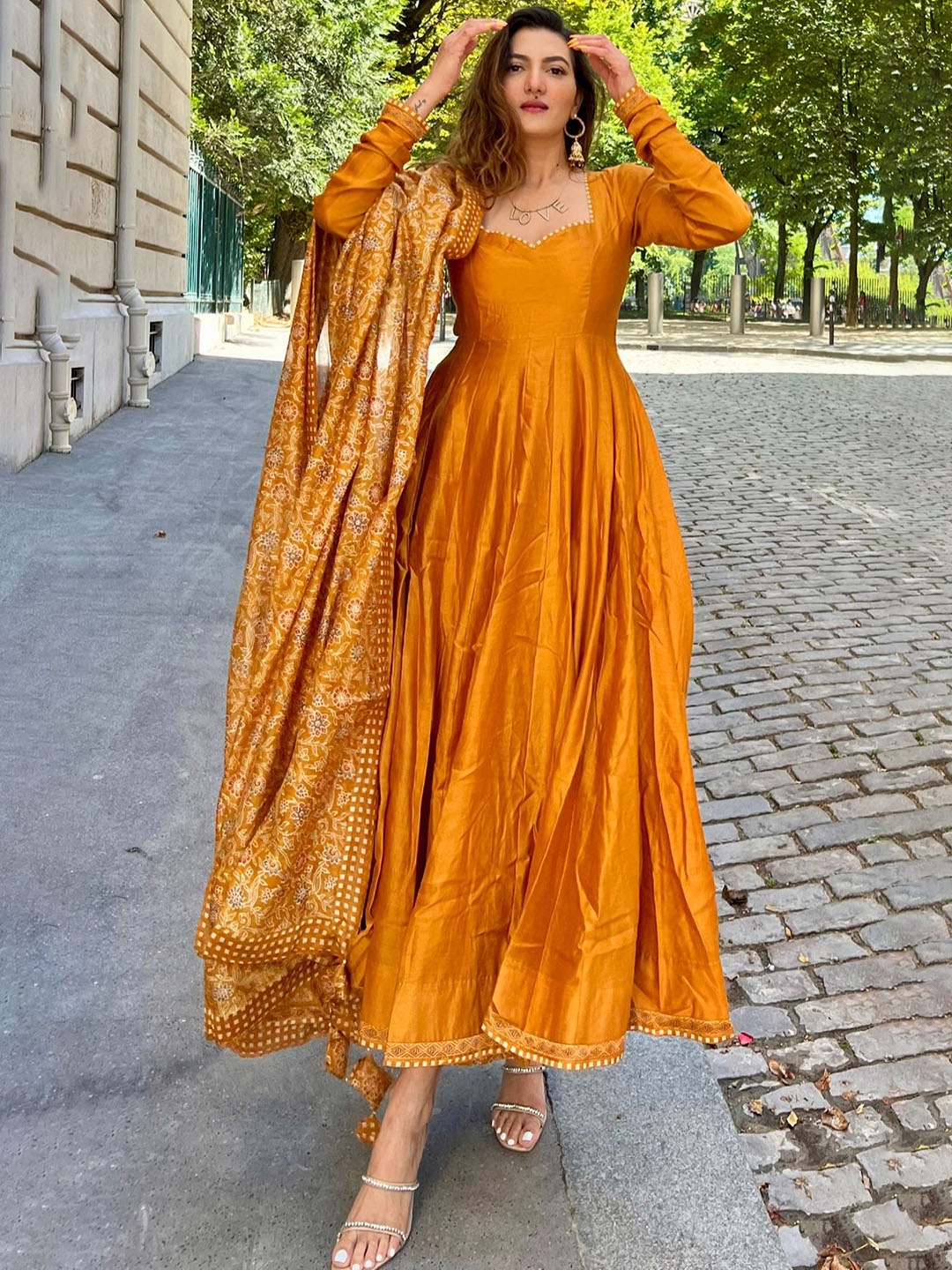 

KALINI Orange Sweetheart Neck Panelled Chanderi Cotton Anarkali Kurta & Palazzo & Dupatta